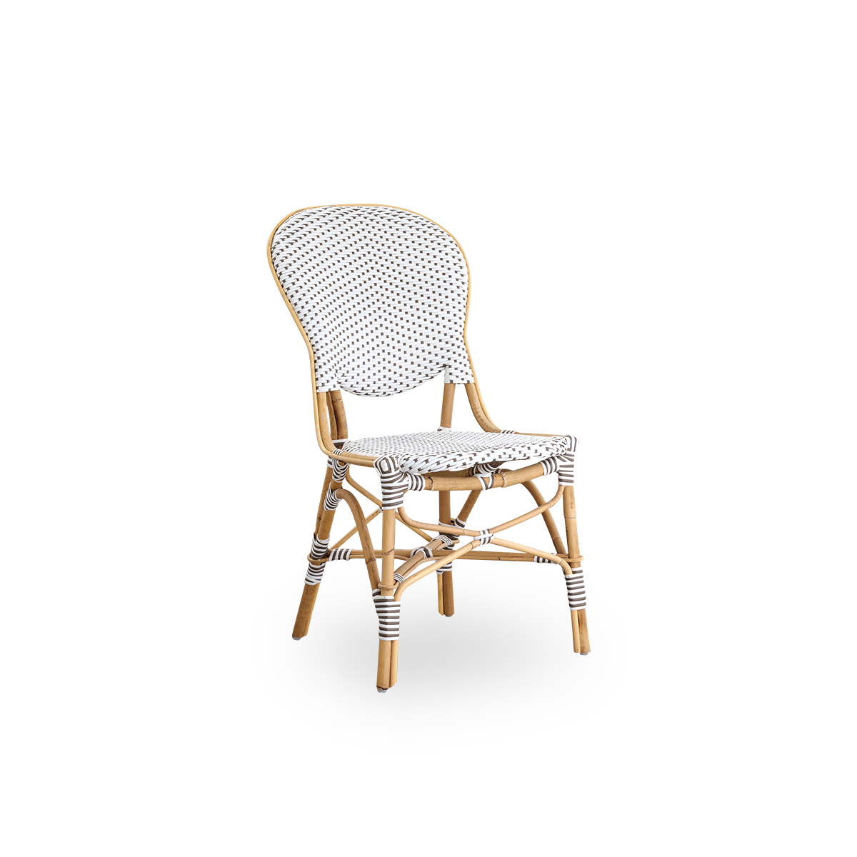 Side view af Isabell spisestol. Rattanramme med sæde og ryg i hvid ArtFibre med brune prikker. Inspireret af 1950’ernes bistrodesign.