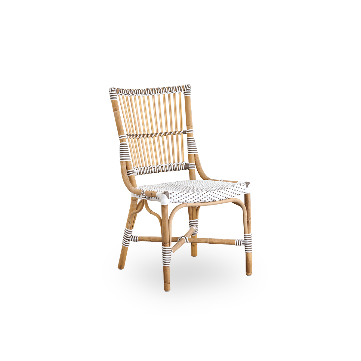 Side view af Monique spisestol. Rattanramme med sæde flettet i ArtFibre i hvid med brune prikker. Inspireret af bistrodesign fra 1950’erne.