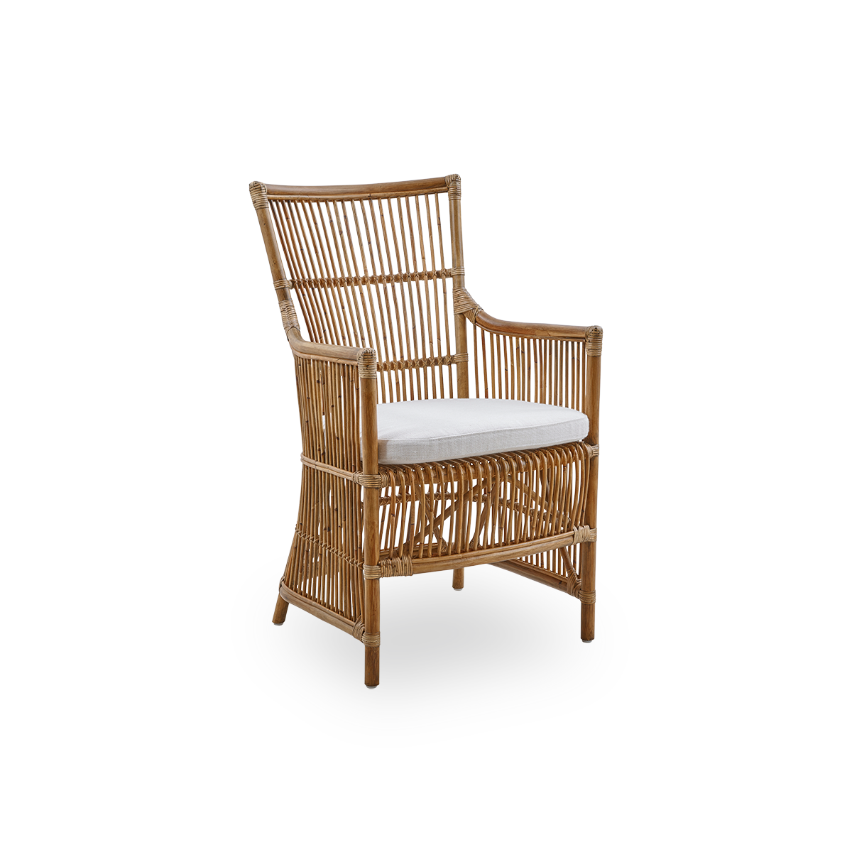 Side view of the Davinci dining chair in antique brown color. A wicker chair with armrests and a high back, handcrafted from high-quality Indonesian rattan.