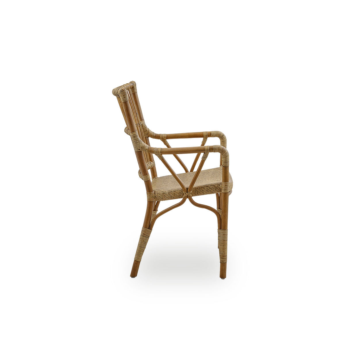 Plain side view of Piano armchair in Antique brown color. Elegant wicker chair with high backrest and armrests handcrafted from high quality Indonesian rattan.