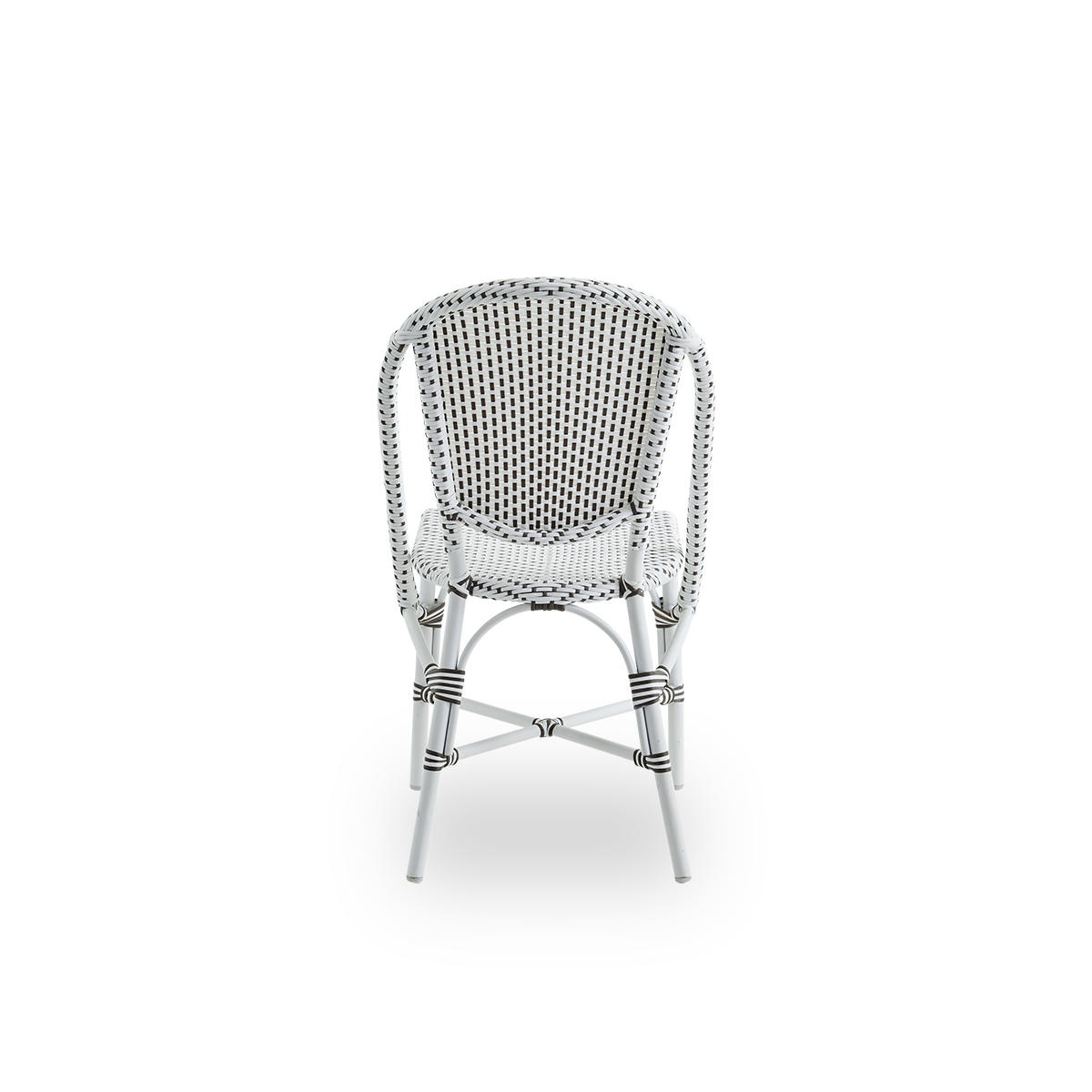 Plain back view of Sofie outdoor dining chair inspired by French café style. Aluminium frame in white color with fully woven seat and backrest handcrafted in ArtFibre in white with brown dots pattern. Stackable outdoor bistro chair.