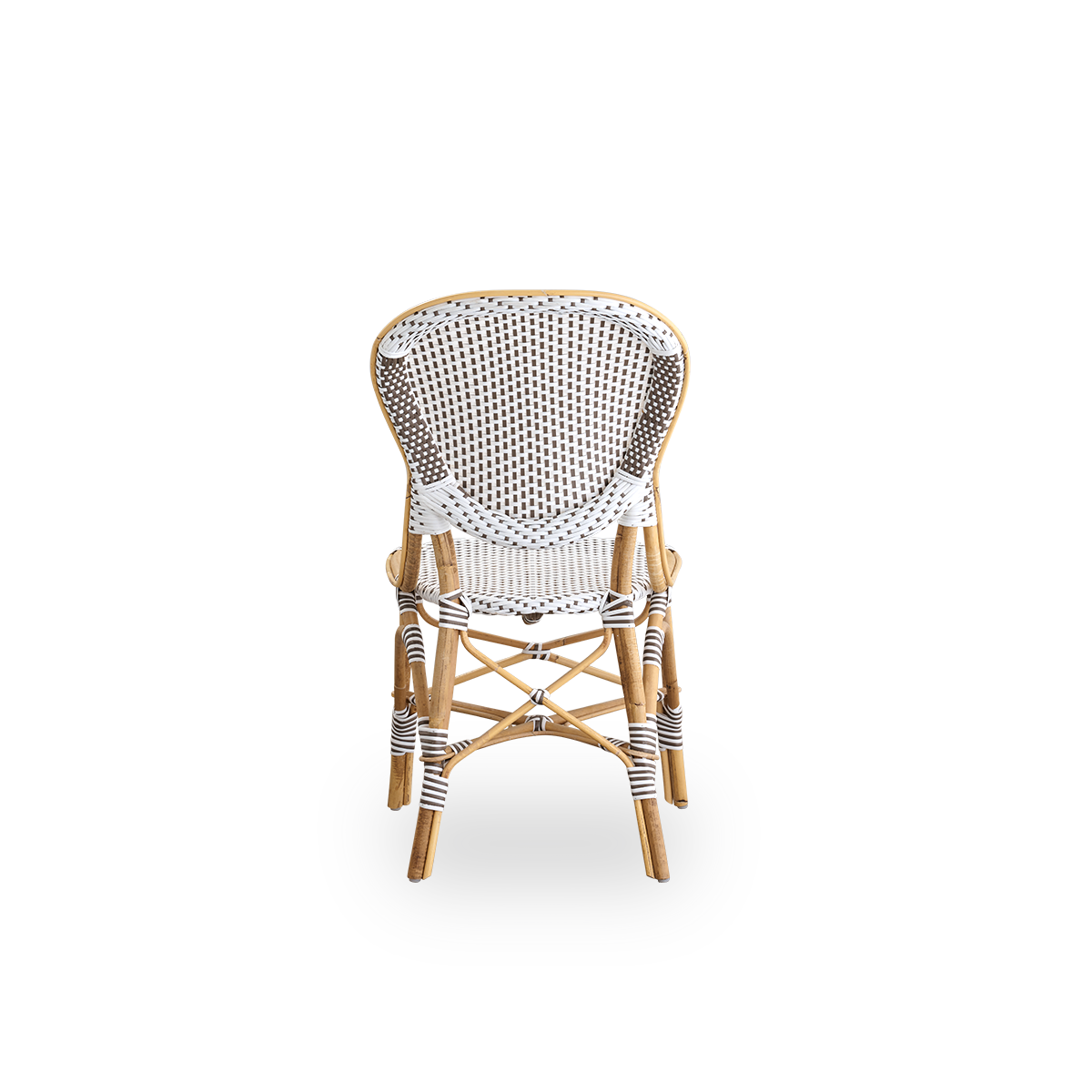 Bagfra vinkel af Isabell spisestol. Rattanramme med sæde og ryglæn i hvid ArtFibre med brune prikker. Inspireret af bistrodesign fra 1950’erne.