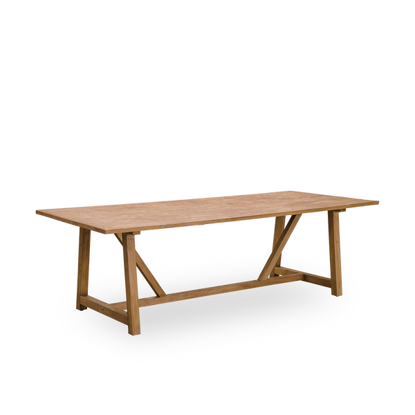 Side view af Lucas indendørs spisebord i patineret teak med rustikt, eksklusivt udseende i naturlig kastanjefarve. Størrelse 240x100 cm, plads til 8 personer.