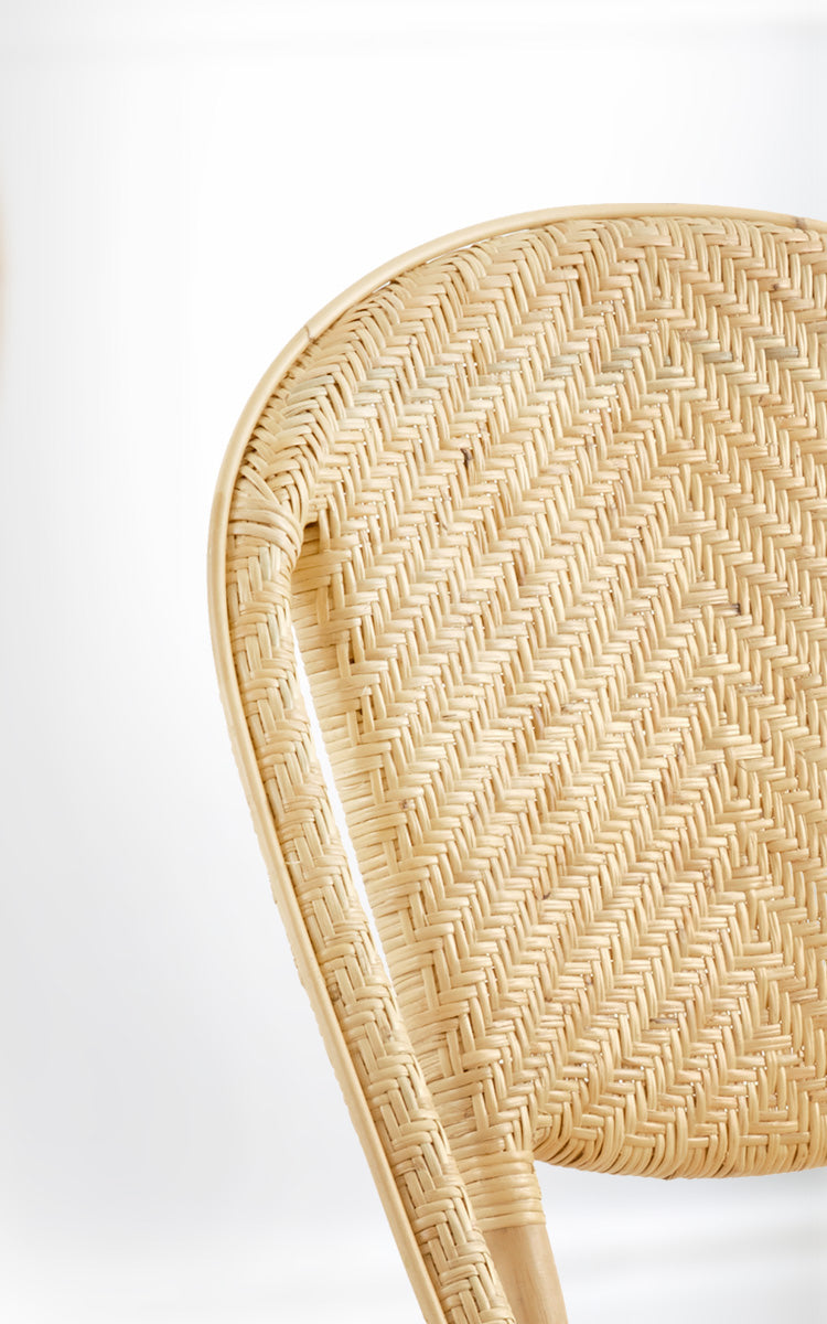 Dette er et nærbillede af Alanis Spisebordsstol i natural rattan.