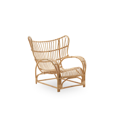 Side view af Teddy loungestol designet af Viggo Boesen, stor omsluttende loungestol inspireret af 1800-tallets wing chair. Håndlavet i høj kvalitet Indonesisk rattan.